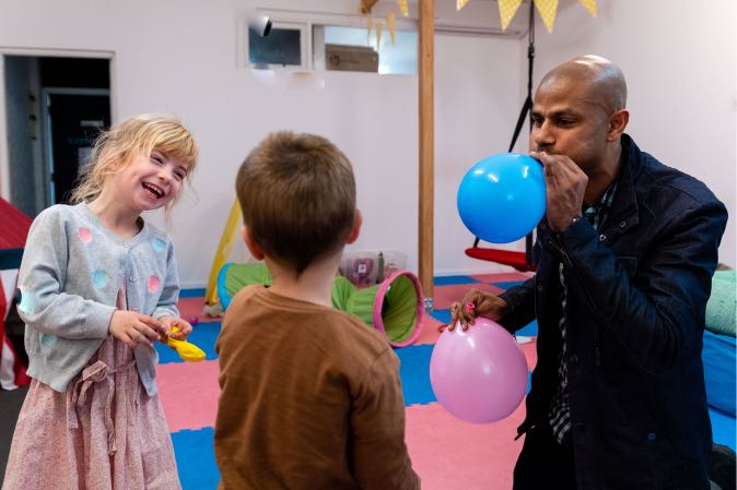 Speech Therapist blowing a balloon for children Speech Therapy at Voice Within Therapy Centre